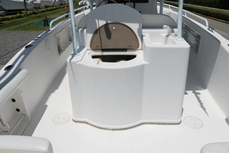 Slide: The Image of 2006 ProKat 2360 Center Console boat interior with open storage compartment. - 13