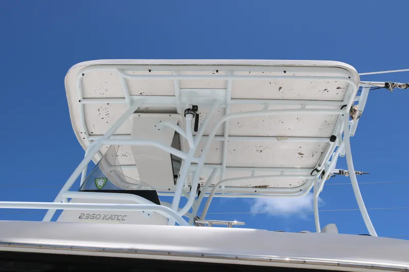 Slide: The Image of 2006 ProKat 2360 Center Console boat top against clear blue sky. - 6