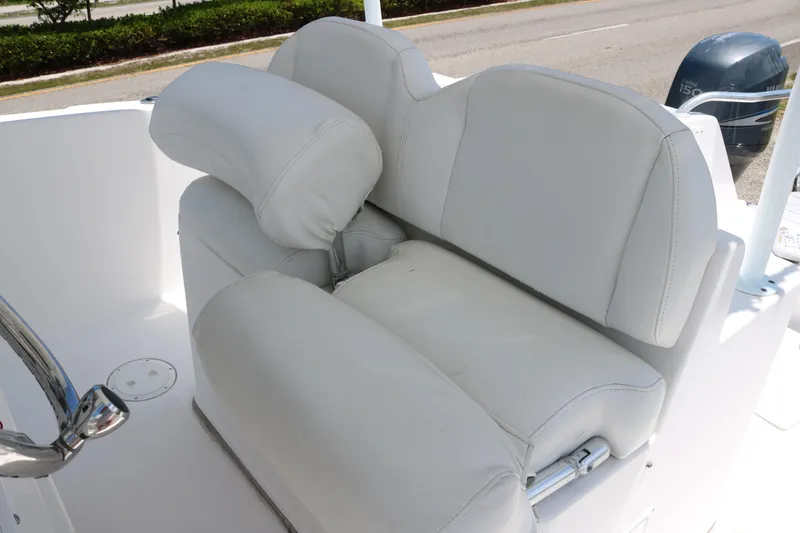 Slide: The Image of 2006 ProKat 2360 Center Console boat with white cushioned seating. - 9