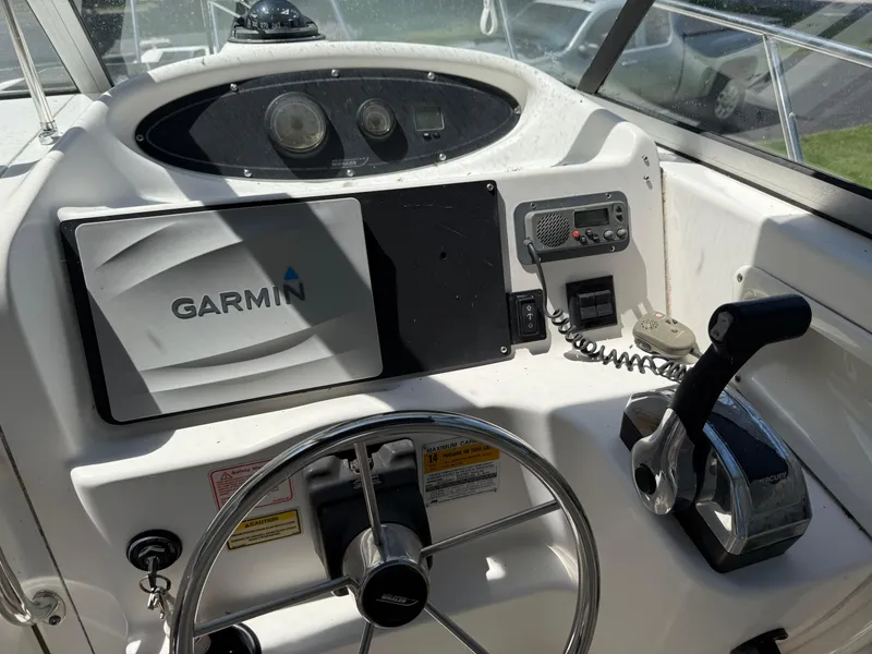 Slide: The Image of Control panel of a 2002 Boston Whaler 255 Conquest with Garmin navigation system. - 15