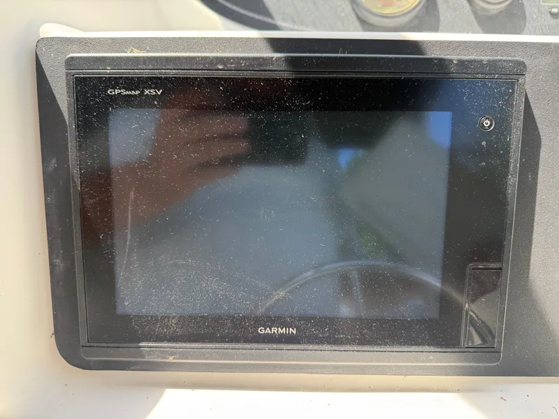Slide: The Image of Garmin GPSMap XSV on 2002 Boston Whaler 255 Conquest dashboard. - 16