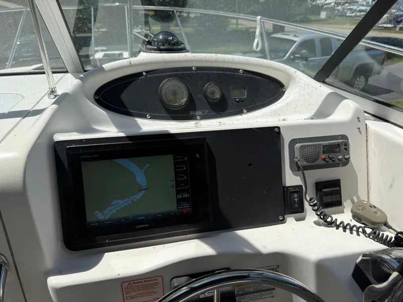 Slide: The Image of Boston Whaler 255 Conquest 2002 boat dashboard with navigation and communication equipment. - 17