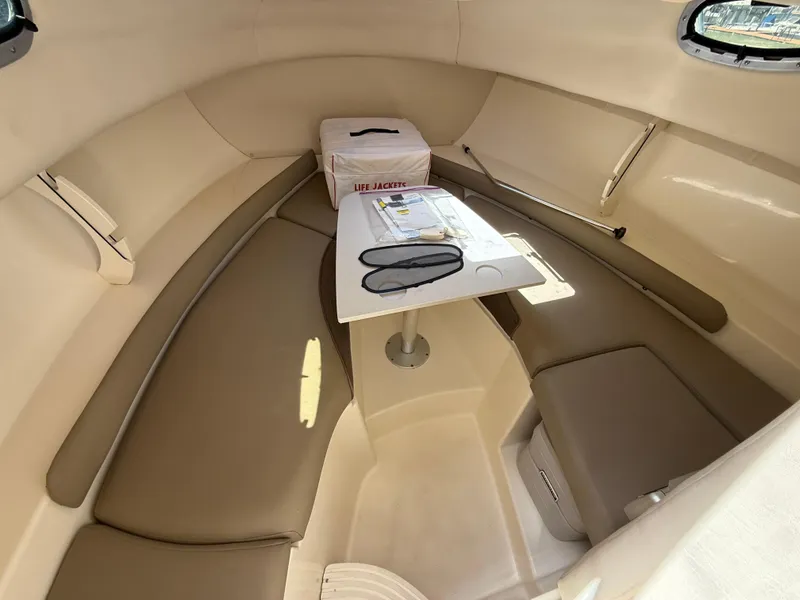 Slide: The Image of Interior of 2002 Boston Whaler 255 Conquest boat with seating and table. - 19