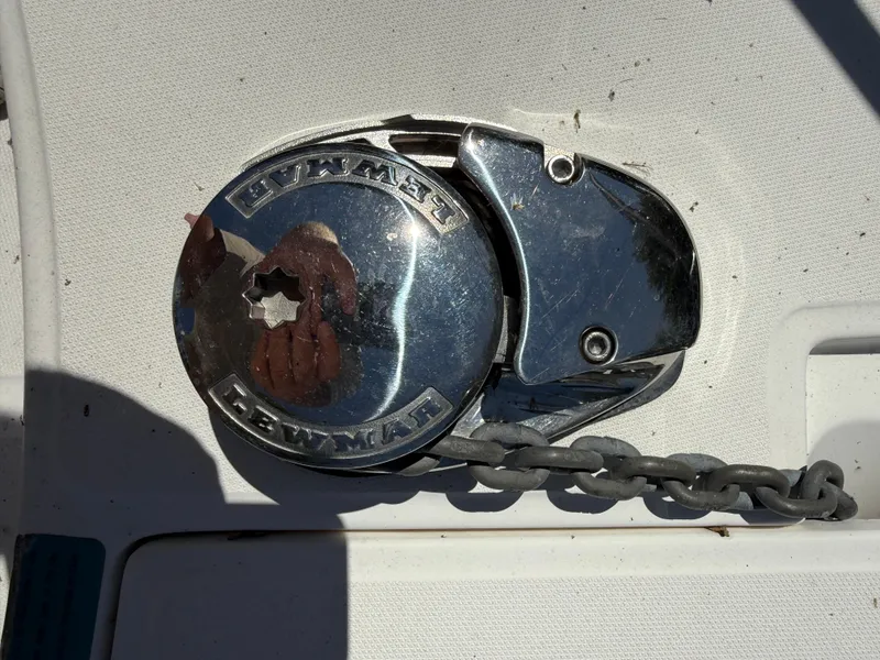 Slide: The Image of Anchor winch on a 2002 Boston Whaler 255 Conquest boat deck. - 28