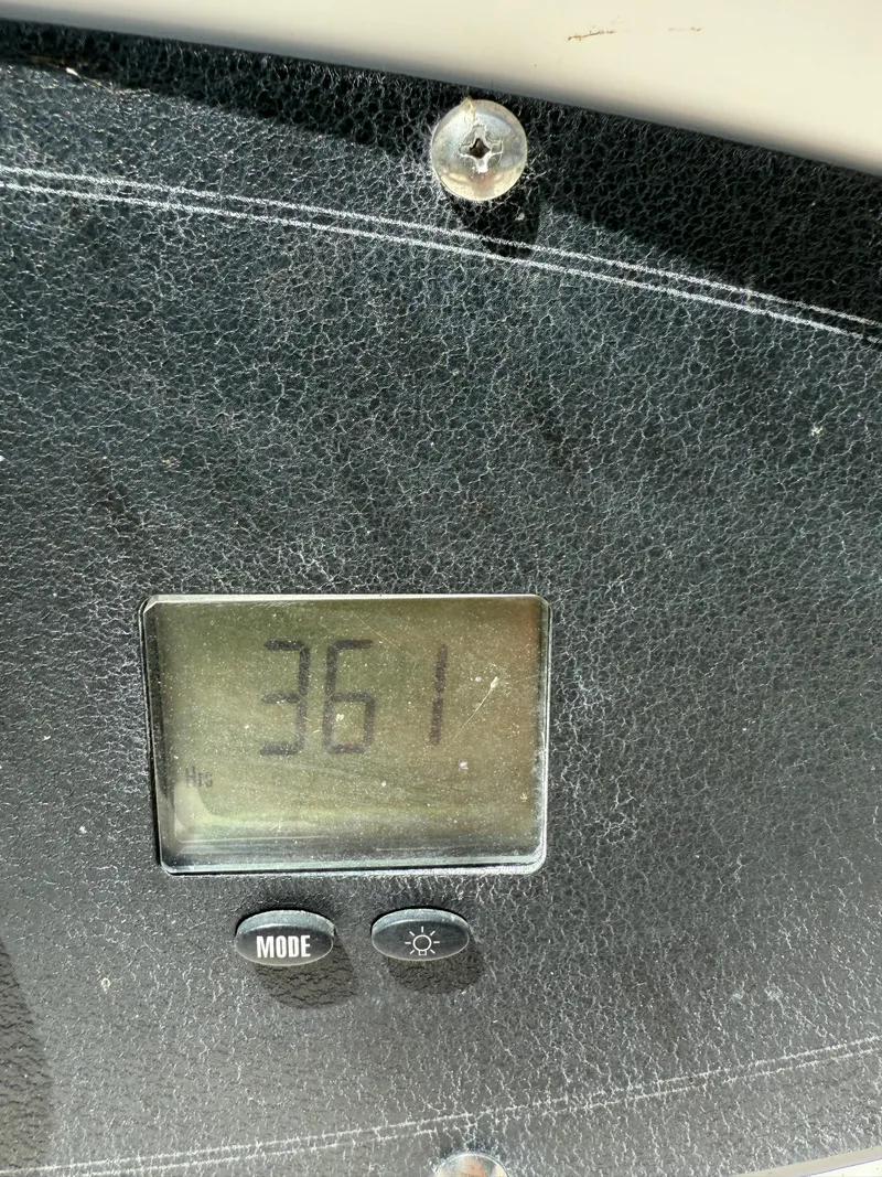 Slide: The Image of Digital display showing 361 hours on a 2002 Boston Whaler 255 Conquest. - 38