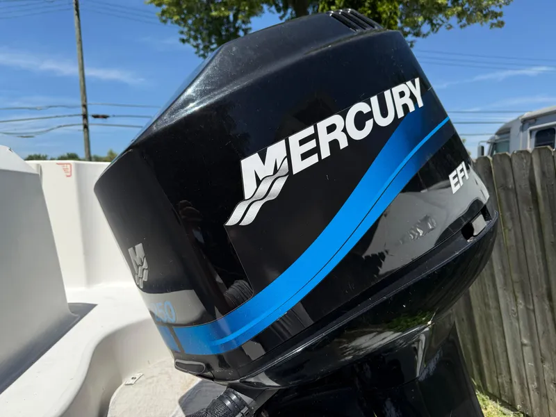 Slide: The Image of Mercury EFI outboard motor on 2002 Boston Whaler 255 Conquest boat. - 6