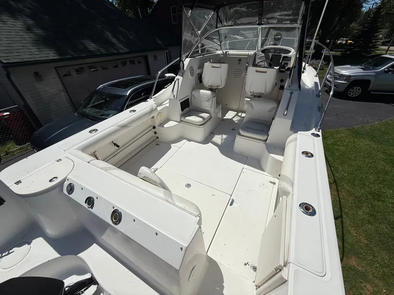 Slide: The Image of 2002 Boston Whaler 255 Conquest boat interior with seating and control panel. - 7