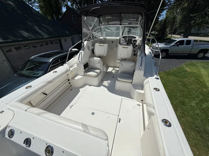 Slide: The Image of 2002 Boston Whaler 255 Conquest boat interior with seating and steering wheel. - 8