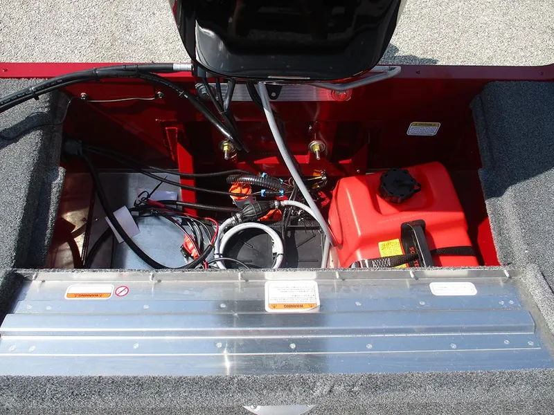 Slide: The Image of 2026 Tracker Super Guide V-16 SC boat interior with fuel tank and wiring. - 11