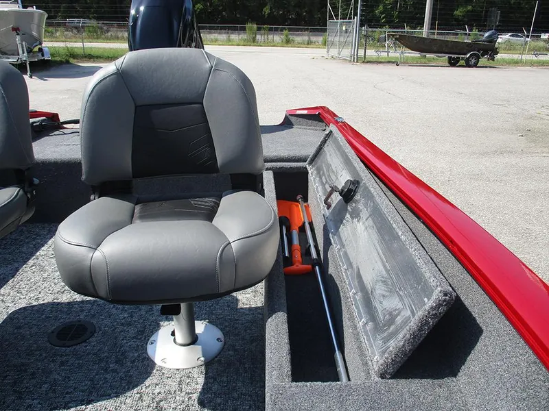 Slide: The Image of 2026 Tracker Super Guide V-16 SC boat seat and storage compartment. - 13