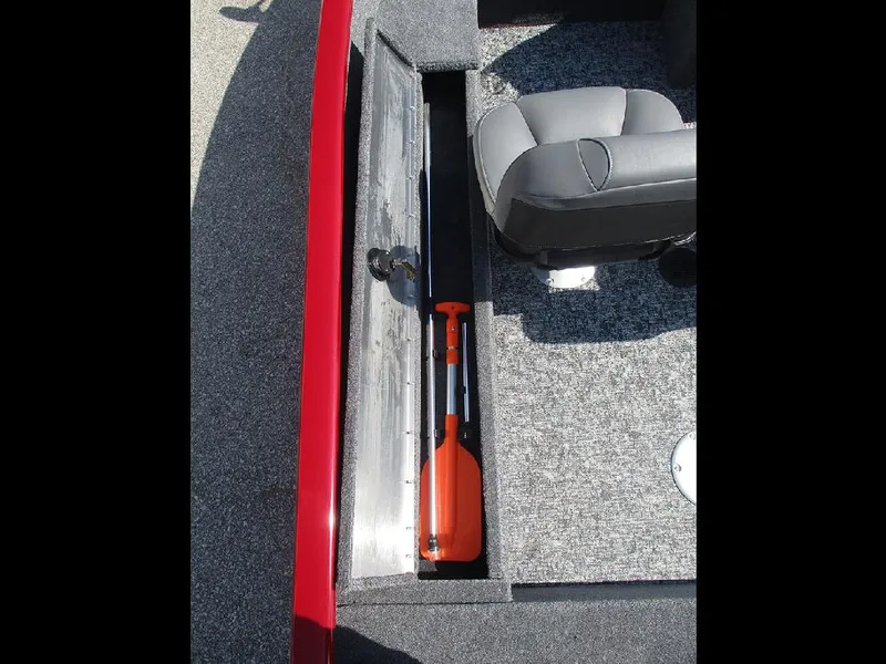 Slide: The Image of 2026 Tracker Super Guide V-16 SC boat interior with storage compartment and seat. - 14