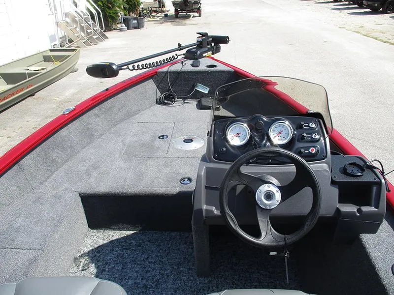 Slide: The Image of 2026 Tracker Super Guide V-16 SC boat interior with steering wheel and control panel. - 15