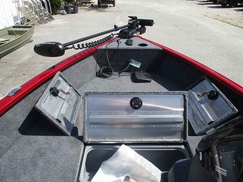 Slide: The Image of 2026 Tracker Super Guide V-16 SC boat interior with storage compartments and trolling motor. - 17