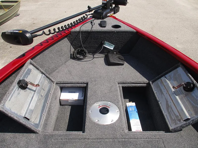 Slide: The Image of Front deck of 2026 Tracker Super Guide V-16 SC boat with storage compartments and trolling motor. - 19