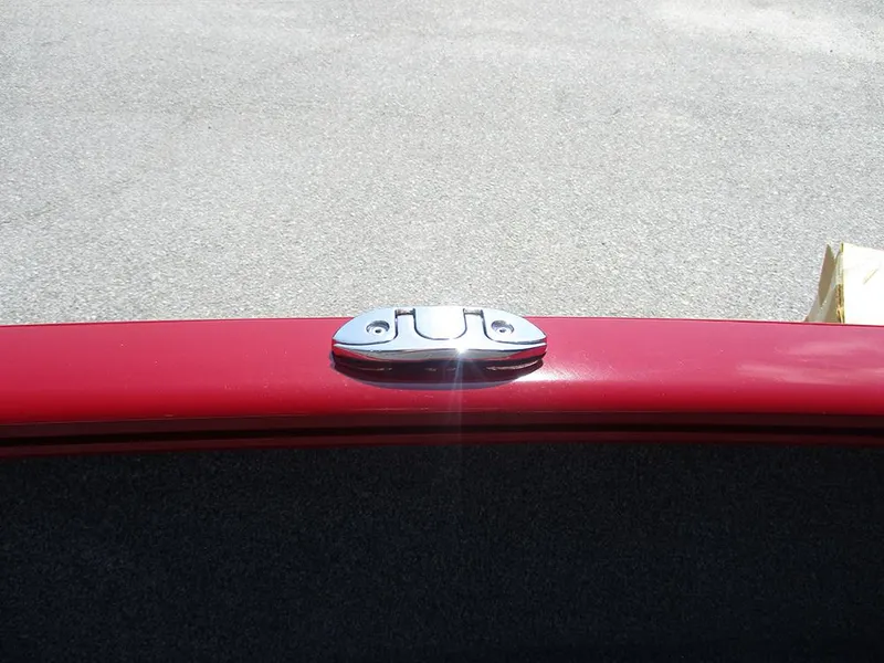 Slide: The Image of Red Tracker Super Guide V-16 SC boat detail with chrome latch, 2026 model. - 23