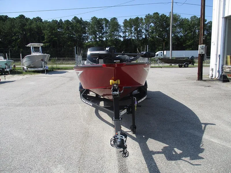 Slide: The Image of 2026 Tracker Super Guide V-16 SC boat on trailer, parked outdoors. - 4