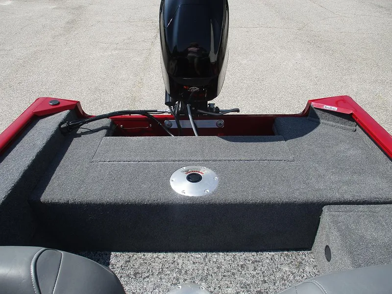 Slide: The Image of 2026 Tracker Super Guide V-16 SC boat interior with motor, red and gray design. - 9