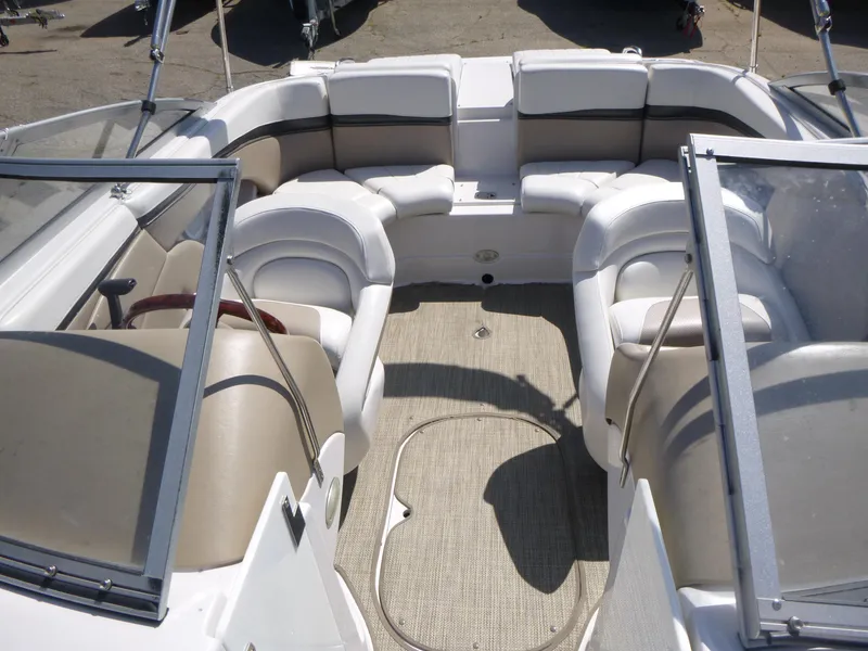 Slide: The Image of 2006 Four Winns 220 Horizon boat interior with beige and white seating. - 6