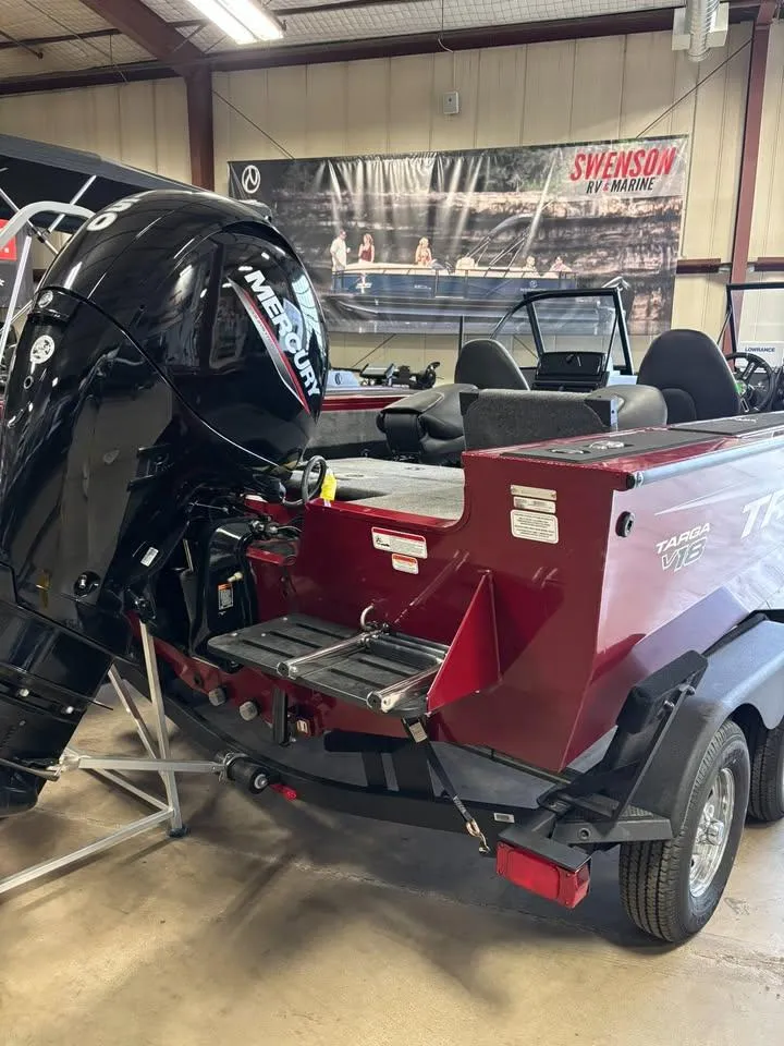 Slide: The Image of 2025 Tracker Targa V-18 Combo boat with Mercury engine in showroom. - 5