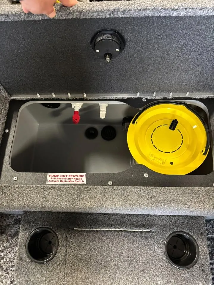 Slide: The Image of 2025 Tracker Targa V-18 Combo livewell with pump-out feature and yellow lid. - 7