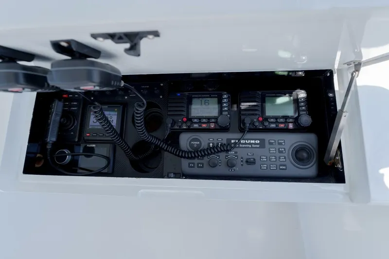 Slide: The Image of Garlington 61 C 2000 boat electronics panel with radios and sonar equipment. - 10