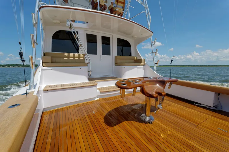 Slide: The Image of Luxury Garlington 61 C yacht deck with wooden flooring, 2000 model, cruising on open water. - 21