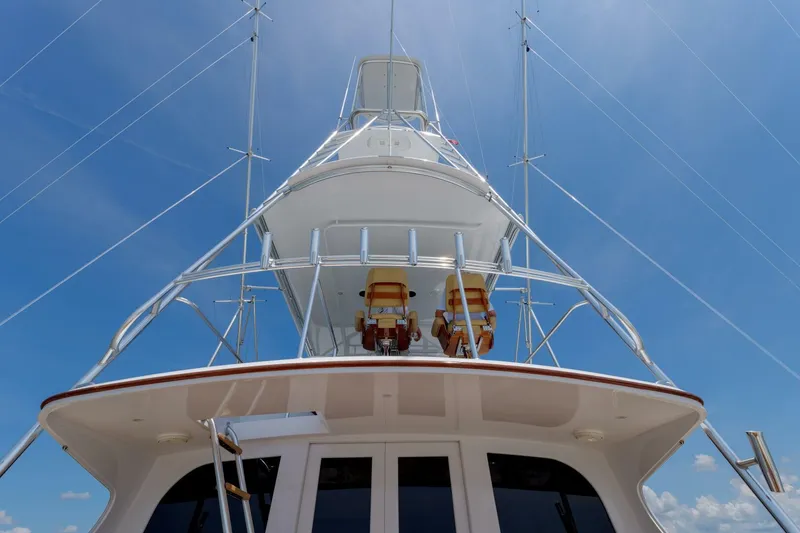 Slide: The Image of Garlington 61 C yacht, 2000 model, viewed from below against a clear blue sky. - 22