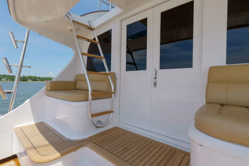 Slide: The Image of Luxury yacht deck with seating and ladder, Garlington 61 C, 2000 model. - 27