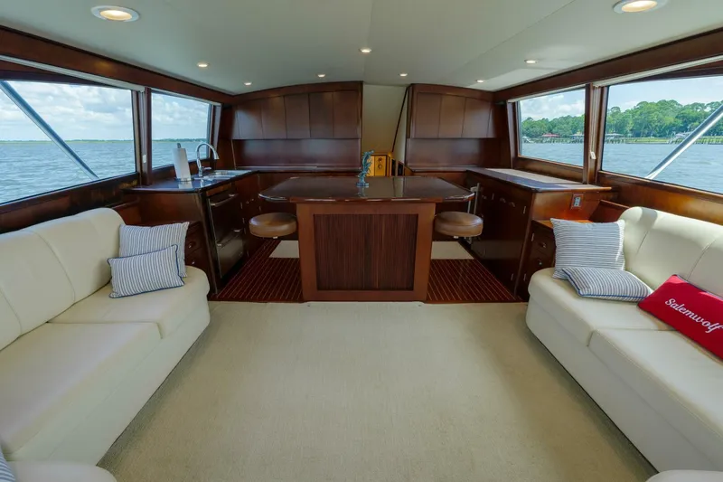 Slide: The Image of Luxurious interior of a 2000 Garlington 61 C yacht with elegant seating and panoramic windows. - 29