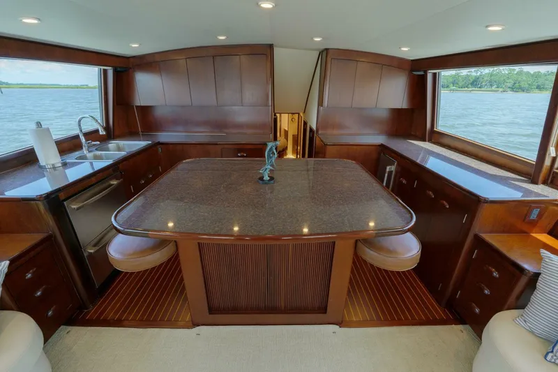 Slide: The Image of Luxurious interior of a 2000 Garlington 61 C yacht with elegant wood finishes and ocean view. - 30