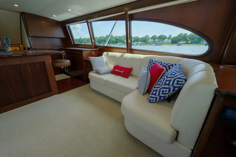 Slide: The Image of Luxurious Garlington 61 C yacht interior with plush seating and scenic window view. - 31