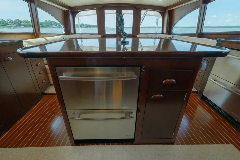 Slide: The Image of Luxurious interior of a 2000 Garlington 61 C yacht with elegant wood cabinetry. - 39