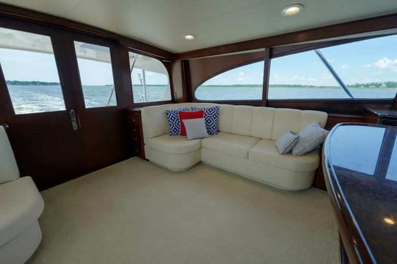 Slide: The Image of Luxurious interior of 2000 Garlington 61 C yacht with plush seating and scenic ocean view. - 42