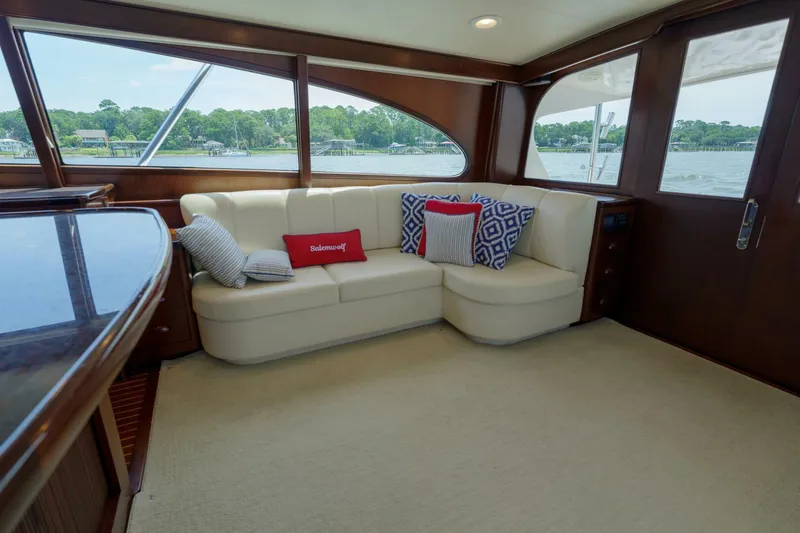 Slide: The Image of Luxurious interior of 2000 Garlington 61 C yacht with plush seating and scenic window views. - 43