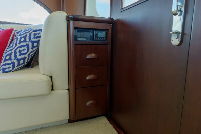 Slide: The Image of Interior of 2000 Garlington 61 C yacht with wooden cabinetry and plush seating. - 44