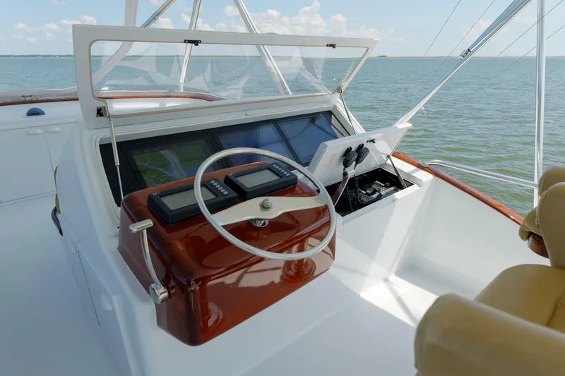Slide: The Image of Helm of 2000 Garlington 61 C yacht with navigation equipment and ocean view. - 7