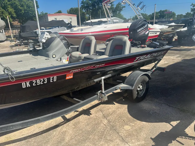 Slide: The Image of 2017 Tracker Pro Team 175 TXW boat on trailer, parked outdoors. - 12