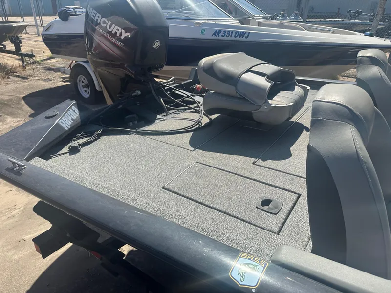 Slide: The Image of 2017 Tracker Pro Team 175 TXW boat with Mercury engine, parked outdoors. - 6