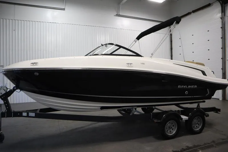 Slide: The Image of 2024 Bayliner VR5 Bowrider boat on trailer in indoor showroom. - 11