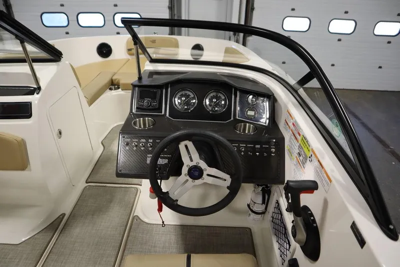 Slide: The Image of 2024 Bayliner VR5 Bowrider dashboard with steering wheel and control panel. - 15