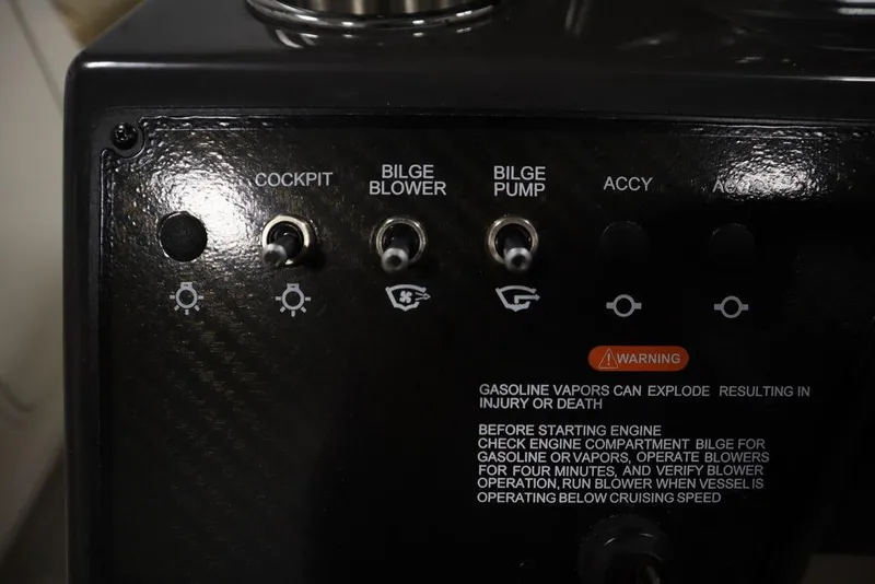 Slide: The Image of Control panel of 2024 Bayliner VR5 Bowrider with cockpit, bilge blower, and pump switches. - 17