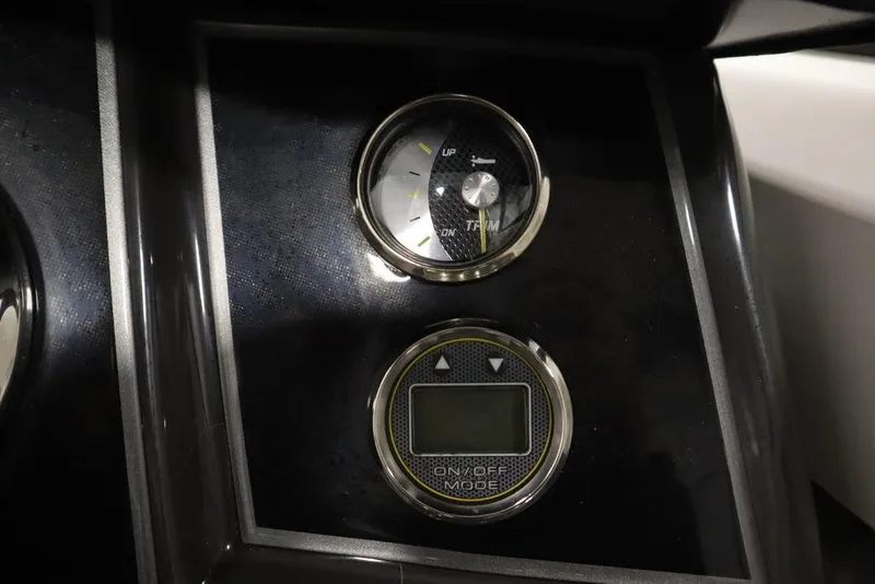 Slide: The Image of 2024 Bayliner VR5 Bowrider dashboard with trim gauge and digital display. - 23