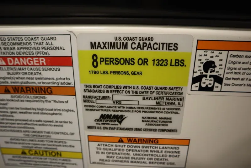 Slide: The Image of Capacity label for 2024 Bayliner VR5 Bowrider: 8 persons or 1323 lbs. - 30