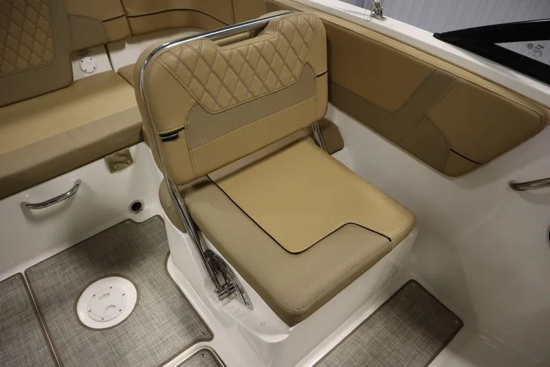 Slide: The Image of 2024 Bayliner VR5 Bowrider interior with tan seating and modern design. - 31
