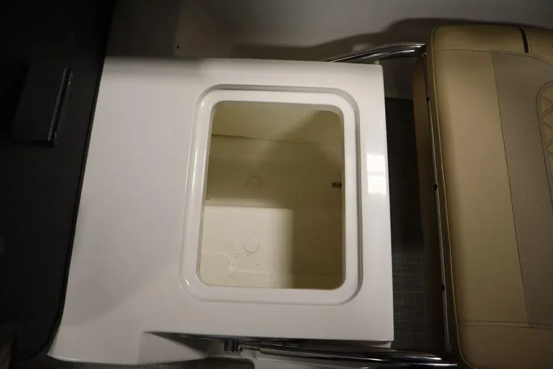Slide: The Image of 2024 Bayliner VR5 Bowrider storage compartment with beige seating. - 34