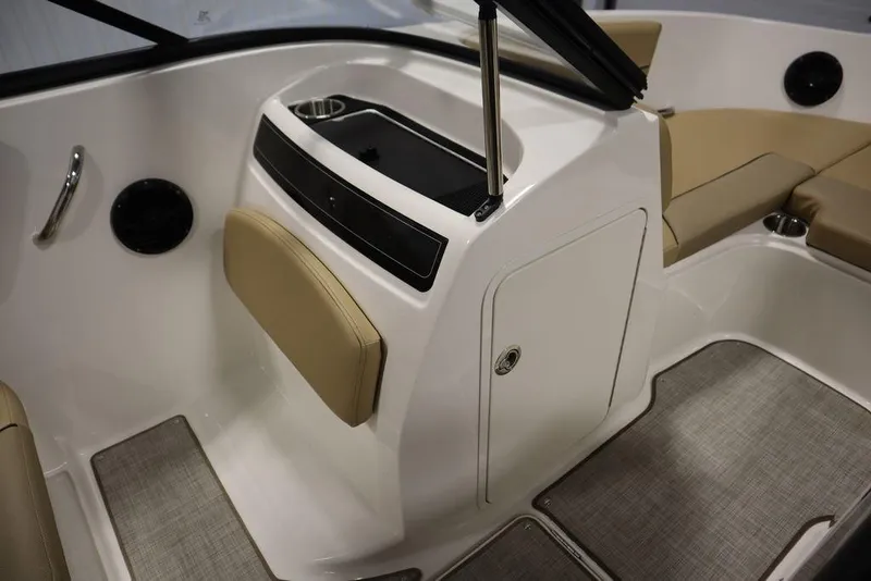 Slide: The Image of 2024 Bayliner VR5 Bowrider interior with beige seating and storage compartment. - 37