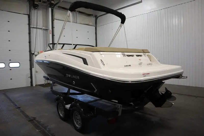 Slide: The Image of 2024 Bayliner VR5 Bowrider in a garage, rear view on trailer. - 4