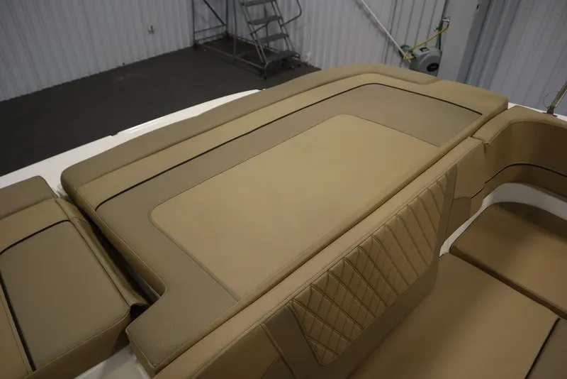 Slide: The Image of 2024 Bayliner VR5 Bowrider interior with tan upholstery and spacious seating. - 40