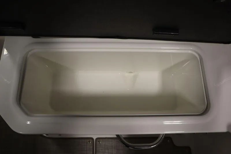 Slide: The Image of 2024 Bayliner VR5 Bowrider storage compartment, open and empty, showcasing interior space. - 42