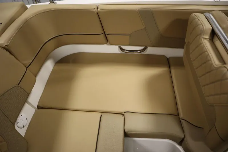 Slide: The Image of 2024 Bayliner VR5 Bowrider interior with tan cushioned seating and sleek design. - 43